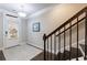 Inviting entryway with staircase, dark wood floors, and natural light at 3152 Quinn Pl, Atlanta, GA 30341