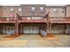Townhome's garage view features wood deck and a mulch bed in front at 3152 Quinn Pl, Atlanta, GA 30341