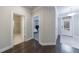 Hallway view to bathroom, bedroom, and front entrance with hardwood floors at 3152 Quinn Pl, Atlanta, GA 30341