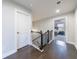 Upstairs hallway with hardwood floors that leads to the primary bedroom suite at 3152 Quinn Pl, Atlanta, GA 30341