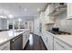 Sleek kitchen with stainless steel appliances, quartz countertops, and modern pendant lights at 3152 Quinn Pl, Atlanta, GA 30341