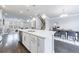 Bright, open kitchen with a large island, stainless steel appliances, and hardwood floors at 3152 Quinn Pl, Atlanta, GA 30341