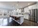 Bright, modern kitchen featuring white cabinets, stainless steel appliances, and a large island at 3152 Quinn Pl, Atlanta, GA 30341