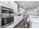 Gourmet kitchen featuring stainless steel appliances, quartz countertops, and custom cabinetry at 3152 Quinn Pl, Atlanta, GA 30341