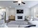 Inviting living room with a fireplace, TV, and open access to the kitchen at 3152 Quinn Pl, Atlanta, GA 30341