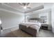 Serene main bedroom features a tray ceiling, neutral decor, and natural light at 3152 Quinn Pl, Atlanta, GA 30341