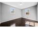 Bright bedroom featuring hardwood floors, gray walls, and a window with natural light at 2814 Lloyd Rd, Decatur, GA 30034