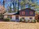 A beautiful two-story home featuring a large front yard, fresh exterior paint, and colorful shutters at 2814 Lloyd Rd, Decatur, GA 30034