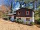 A beautiful two-story home featuring a large front yard, fresh exterior paint, and colorful shutters at 2814 Lloyd Rd, Decatur, GA 30034