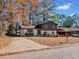 Beautiful two-story home featuring fresh paint, orange shutters, and a large driveway at 2814 Lloyd Rd, Decatur, GA 30034