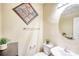 Well-maintained half-bath with a round mirror and cute decor at 3068 Cedar Glade Ln, Buford, GA 30519