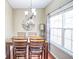 Formal dining room with hardwood floors and lots of natural light from large window at 3068 Cedar Glade Ln, Buford, GA 30519