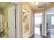 Hallway with a laundry area and a view to a bedroom with a desk at 3068 Cedar Glade Ln, Buford, GA 30519