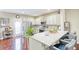 Modern kitchen with granite countertops, stainless steel appliances, and breakfast bar seating at 3068 Cedar Glade Ln, Buford, GA 30519