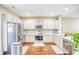 Contemporary kitchen featuring stainless steel appliances, granite countertops, and ample cabinet space at 3068 Cedar Glade Ln, Buford, GA 30519