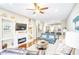 Bright living room featuring a fireplace, hardwood floors, and comfortable seating at 3068 Cedar Glade Ln, Buford, GA 30519