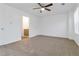 Spacious bedroom with neutral carpet, closet, and bathroom access at 3541 Parc Sw Cir, Atlanta, GA 30311