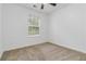 Neutral bedroom featuring a ceiling fan and window providing natural light at 3541 Parc Sw Cir, Atlanta, GA 30311