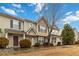 Attractive townhome featuring covered porch, neutral siding, stone accents, and mature landscaping at 3541 Parc Sw Cir, Atlanta, GA 30311
