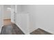 Hallway with wood-look flooring and white walls leading to bedroom at 3541 Parc Sw Cir, Atlanta, GA 30311