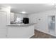 Bright kitchen featuring white cabinets, modern appliances, and breakfast bar at 3541 Parc Sw Cir, Atlanta, GA 30311