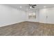 Bright and airy living room with modern flooring, neutral walls, ceiling fan, and natural lighting at 3541 Parc Sw Cir, Atlanta, GA 30311