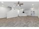Open-concept living room with modern flooring, neutral walls, ceiling fan, and easy access to kitchen at 3541 Parc Sw Cir, Atlanta, GA 30311