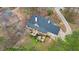 Aerial view showcases the home's expansive deck and gazebo, nestled amidst lush greenery and mature trees at 3773 Galdway Dr, Snellville, GA 30039