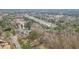 Birds-eye view of the community surrounded by beautiful landscaping, trees, and a nearby lake at 3773 Galdway Dr, Snellville, GA 30039