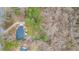 Drone perspective of home featuring lush landscaping with established trees for privacy at 3773 Galdway Dr, Snellville, GA 30039