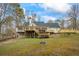 A verdant backyard featuring tiered decking, a relaxing gazebo, and ample space for outdoor enjoyment and recreation at 3773 Galdway Dr, Snellville, GA 30039