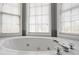 Relaxing soaking tub with jets and natural light at 3773 Galdway Dr, Snellville, GA 30039