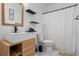 Modern bathroom featuring a vessel sink, floating shelves, and marble-look tile flooring at 3773 Galdway Dr, Snellville, GA 30039