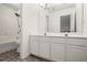 Bright bathroom with double vanity and shower/tub at 3773 Galdway Dr, Snellville, GA 30039
