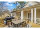 Spacious outdoor deck with large grill and outdoor seating, perfect for al fresco dining and entertaining guests at 3773 Galdway Dr, Snellville, GA 30039