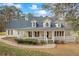 Charming two-story home featuring a large, inviting front porch and traditional architectural details at 3773 Galdway Dr, Snellville, GA 30039