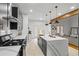 Spacious kitchen with a large island, stainless steel appliances, and an open layout to the living area at 3773 Galdway Dr, Snellville, GA 30039