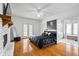 Spacious main bedroom with hardwood floors, fireplace, and ensuite bathroom at 3773 Galdway Dr, Snellville, GA 30039