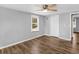 Bedroom featuring a window, closet, wood floor and light gray walls at 3898 Panthersville Rd, Ellenwood, GA 30294