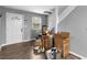 Entryway showcasing wood-look floors, a staircase, and a front door, while it is full of moving supplies at 3898 Panthersville Rd, Ellenwood, GA 30294