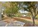 Backyard with concrete patio area, a grass hill, and a wooden fence at 4710 Vineyard Se Ct, Smyrna, GA 30082