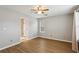 Bedroom with wood-look floors, a ceiling fan and en-suite bathroom at 4710 Vineyard Se Ct, Smyrna, GA 30082