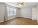 Bedroom with wood-look floors, a ceiling fan and neutral paint at 4710 Vineyard Se Ct, Smyrna, GA 30082