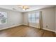 Bedroom with wood-look floors, a ceiling fan and neutral paint at 4710 Vineyard Se Ct, Smyrna, GA 30082
