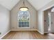 Dining room featuring a large window and wood-look flooring at 4710 Vineyard Se Ct, Smyrna, GA 30082
