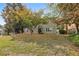 Attractive single-Gathering home with a sloping front yard, mature trees, and well-kept lawn providing curb appeal at 4710 Vineyard Se Ct, Smyrna, GA 30082