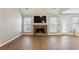 Spacious living room featuring a stone fireplace and modern flooring at 4710 Vineyard Se Ct, Smyrna, GA 30082