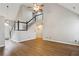 Open living room area with staircase and light wood floors at 4710 Vineyard Se Ct, Smyrna, GA 30082