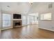 Cozy living room featuring a stone fireplace and access to the backyard at 4710 Vineyard Se Ct, Smyrna, GA 30082