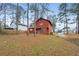 Exterior view of home from backyard with mature trees at 1057 Forest Path, Stone Mountain, GA 30088